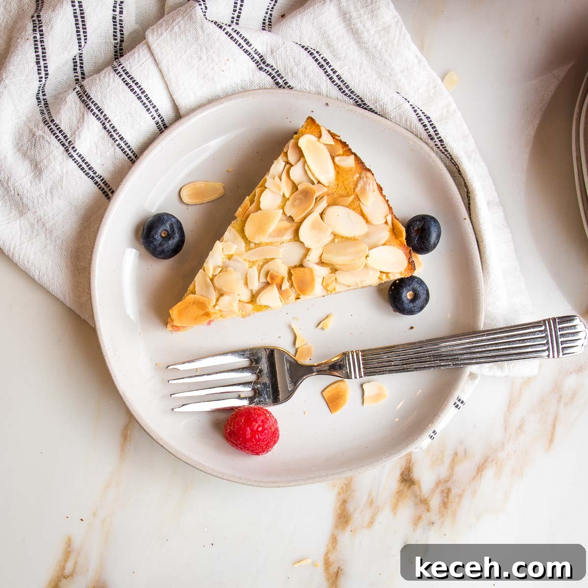Rosh Hashanah 2026: Festive Recipes and Complete Menu Planner 45 Slice of lemon cake topped with sliced almonds.