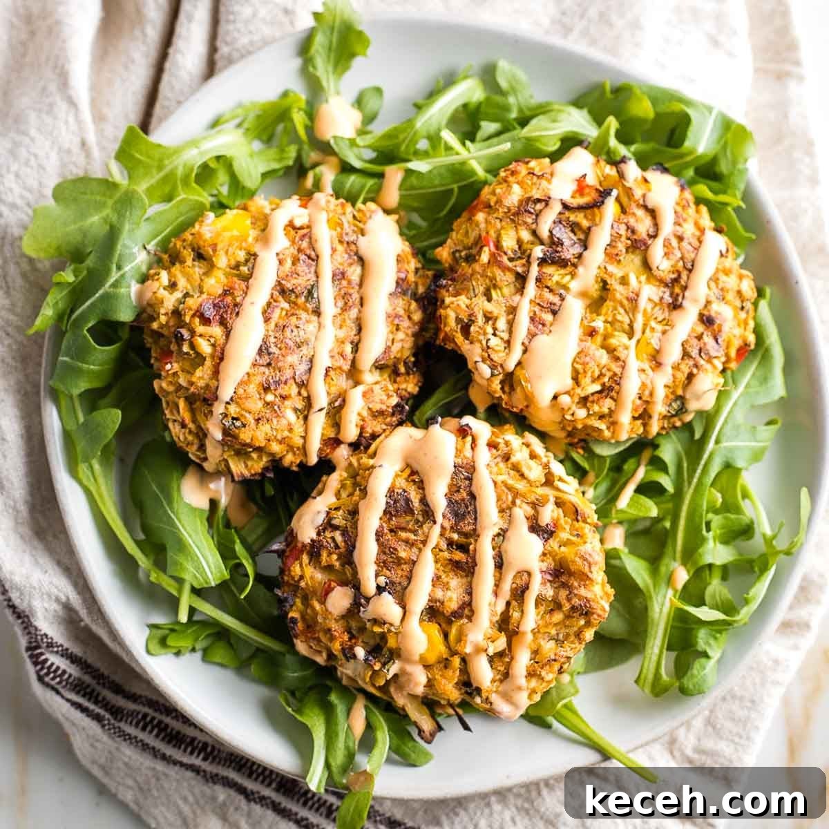 Rosh Hashanah 2026: Festive Recipes and Complete Menu Planner 48 Vegan crab cakes atop arugula with sriracha tahini.