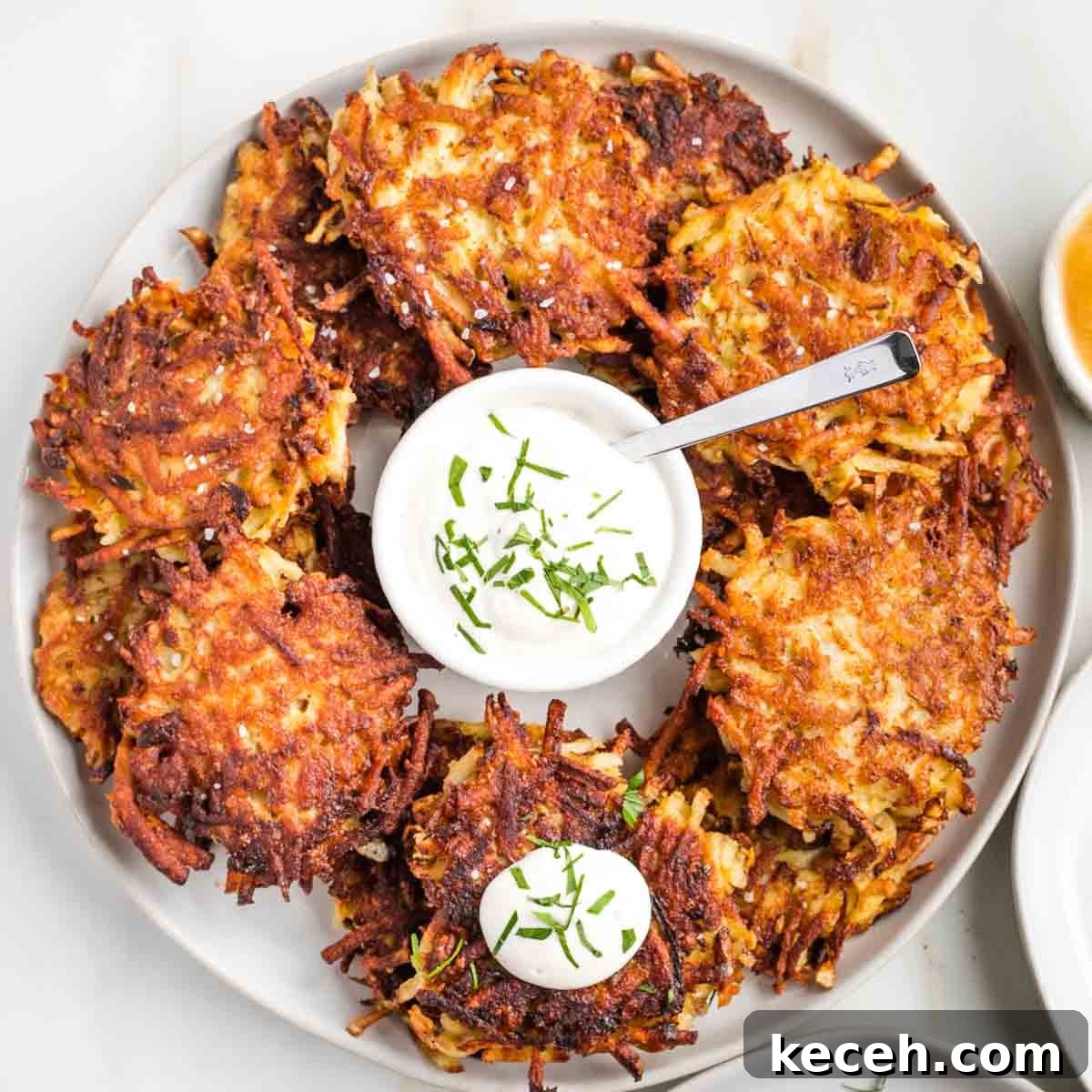 Rosh Hashanah 2026: Festive Recipes and Complete Menu Planner 49 Crispy potato latkes on a platter.