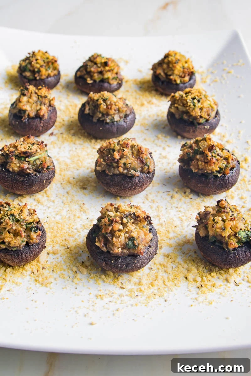 Rosh Hashanah 2026: Festive Recipes and Complete Menu Planner 50 White serving plate with stuffed mushrooms.
