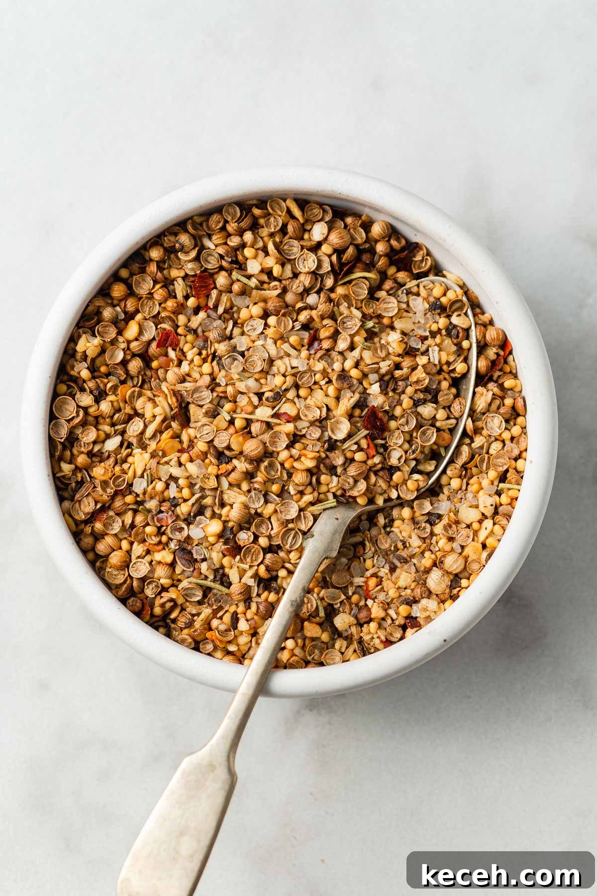 montreal steak seasoning on a bowl with a spoon.