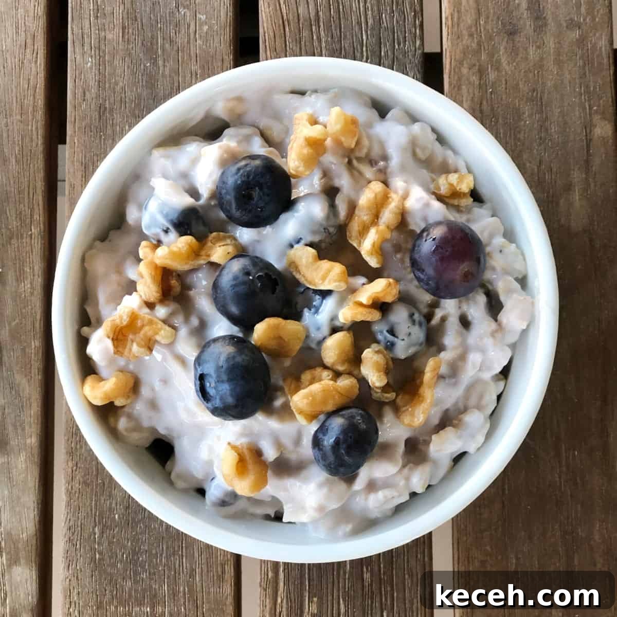 Blueberry and Maple Overnight Oats Recipe for Quick Breakfast 9 Blueberry maple overnight oats topped with toasted walnuts and fresh blueberries from above.