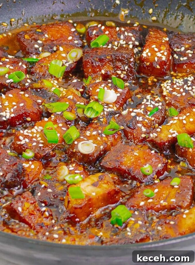 Sticky Chinese Pork Belly Recipe: Caramelized Soy-Glazed Pork Belly 9 close up of Chinese pork belly in sauce pan