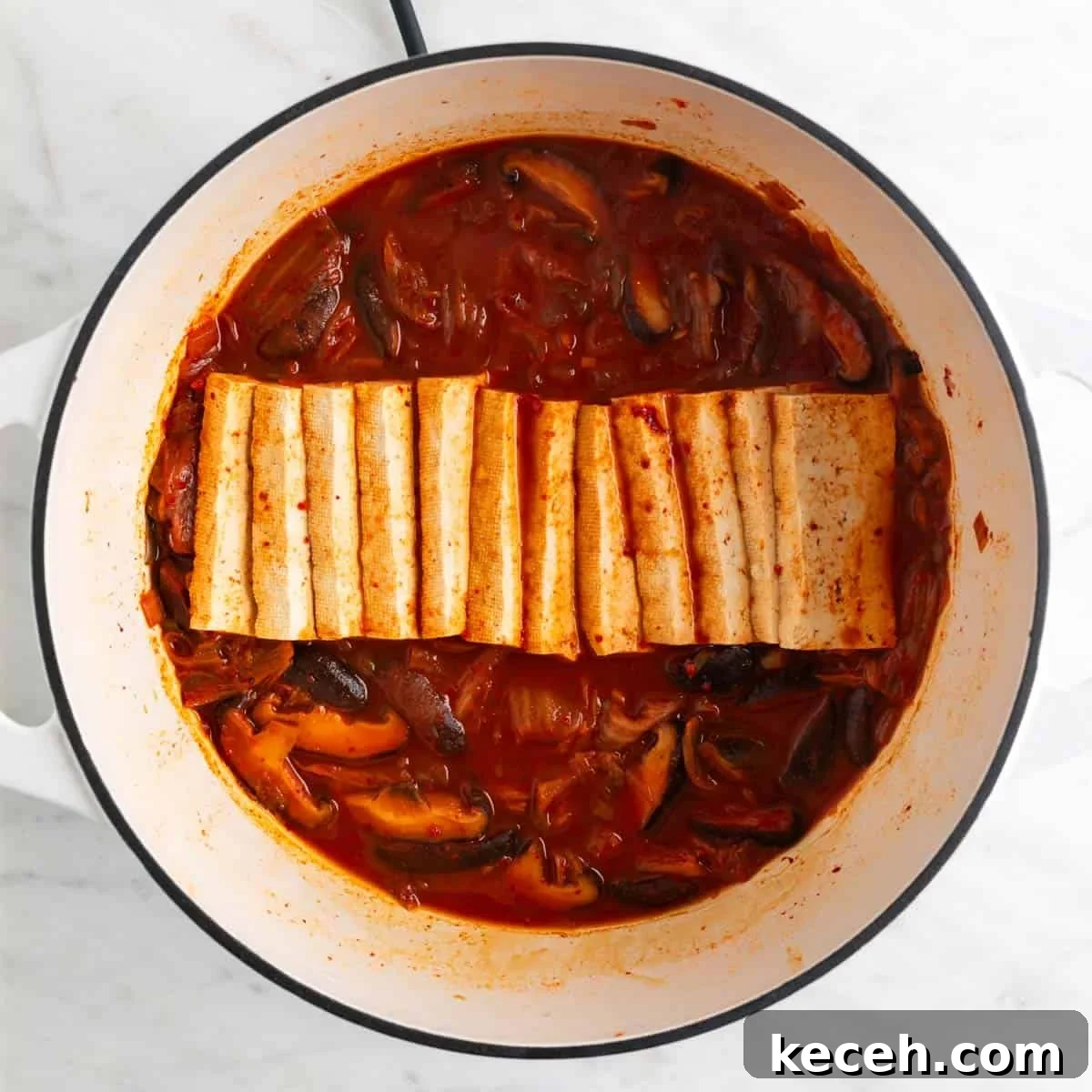 Vegan Kimchi Jjigae Recipe — Spicy Korean Kimchi Stew 8 Vegan kimchi stew in a large pot.