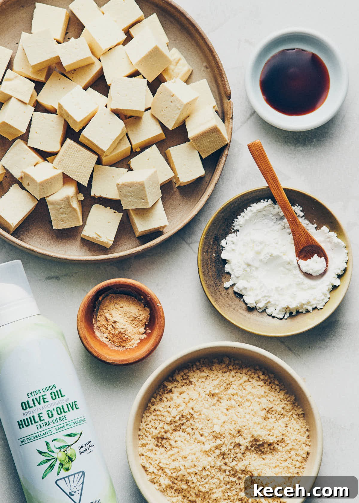 Crispy Air Fryer Breaded Tofu Recipe 5 Ingredients to make crispy air fryer tofu: cubed tofu, garlic powder, panko breadcrumbs, cornstarch, tamari, and oil spray