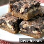 Chocolate Peanut Butter Magic Bars Recipe: Gooey Layered Cookie Bars 2 stack of chocolate peanut butter magic bars