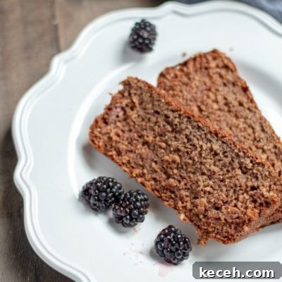 This blackberry banana breakfast bread has a hearty oat texture and a light blackberry flavor that is perfect topped with butter and a drizzle of honey. It is also protein-packed, gluten-free, and has no refined sugar.