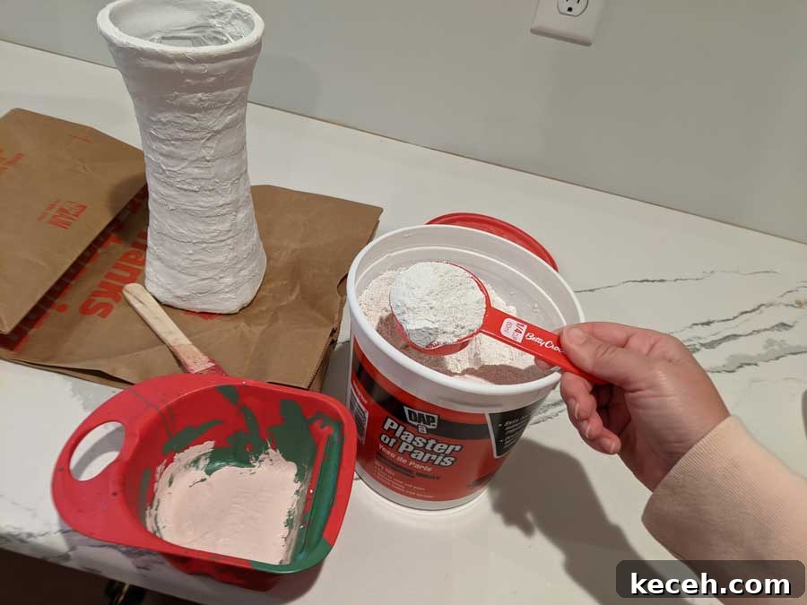 Use two parts plaster to one part cold water to create the correct plaster consistency for painting