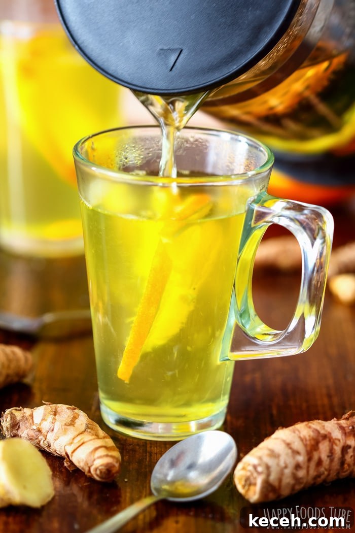 Pouring Immune Boosting Turmeric Tea Picture Pouring Immune Boosting Turmeric Tea Picture