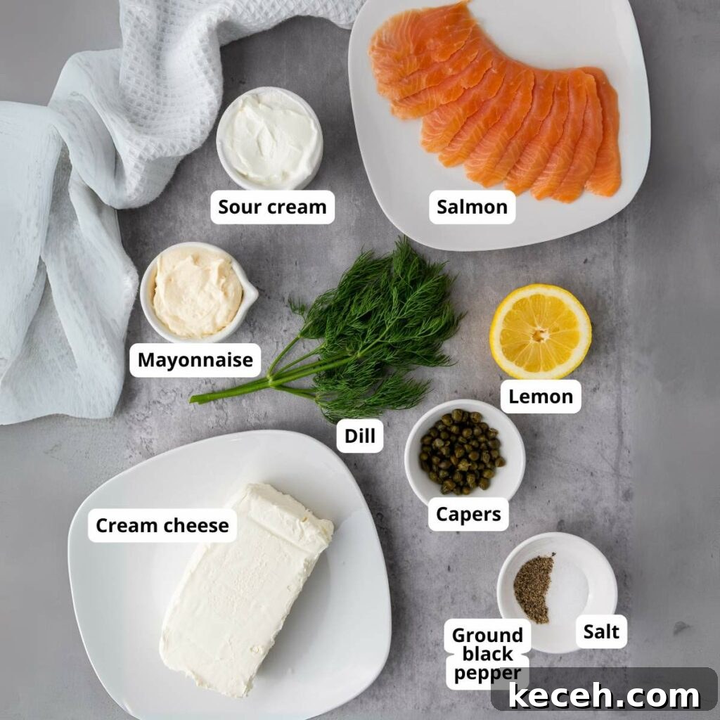 Ingredients for salmon dip laid out on a gray surface.