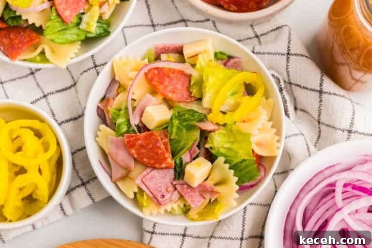 Fresh Summer Dinner Ideas: Light, Flavorful Recipes for Warm Nights 11 Italian Pasta Salad served in a white bowl.