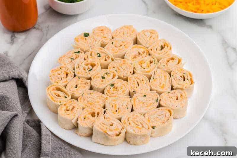 Fresh Summer Dinner Ideas: Light, Flavorful Recipes for Warm Nights 17 Buffalo Chicken Pinwheels served on a white plate.