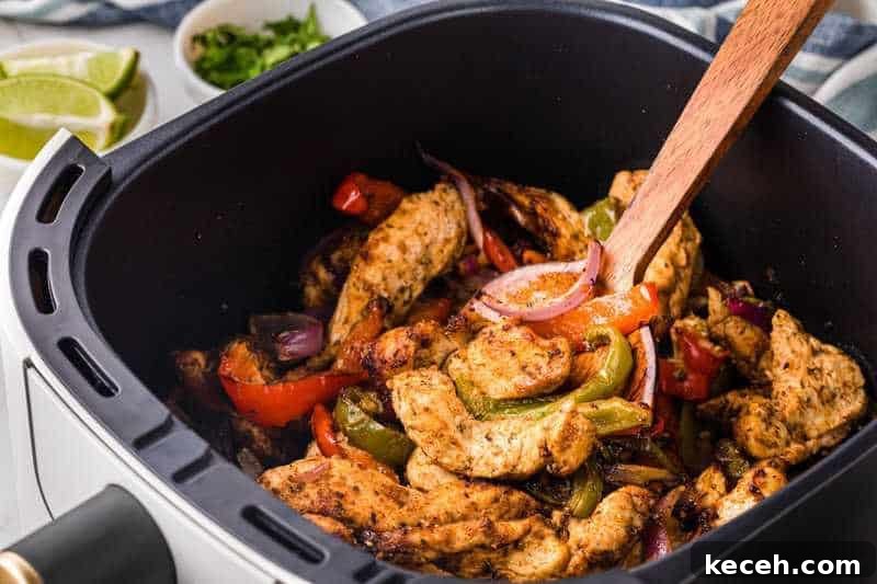 Fresh Summer Dinner Ideas: Light, Flavorful Recipes for Warm Nights 20 Closeup of the Air Fryer Chicken Fajitas in the air fryer basket.