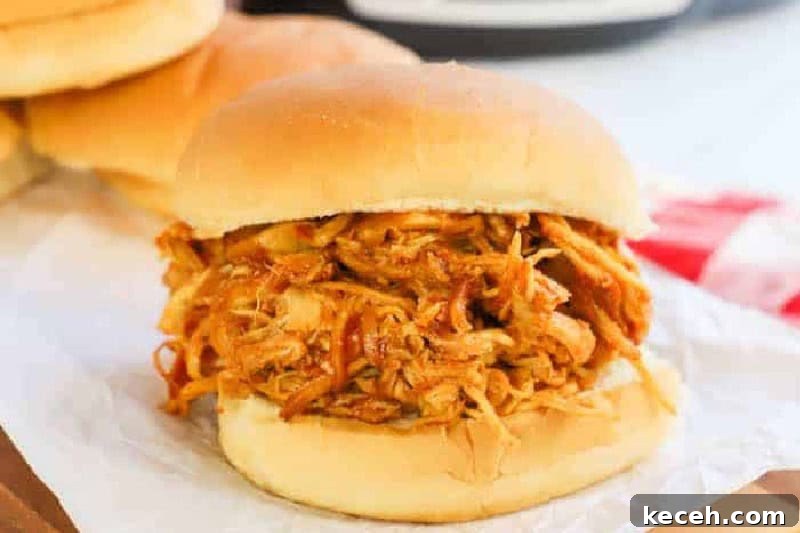 Fresh Summer Dinner Ideas: Light, Flavorful Recipes for Warm Nights 3 Slow Cooker BBQ Chicken Sandwiches on parchment paper.