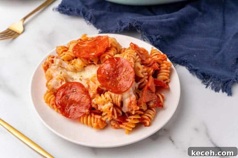 Fresh Summer Dinner Ideas: Light, Flavorful Recipes for Warm Nights 24 Pepperoni Pizza Casserole served on a white plate.