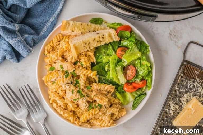 Fresh Summer Dinner Ideas: Light, Flavorful Recipes for Warm Nights 6 top-down picture of the slow cooker Italian Chicken Pasta served with a salad.