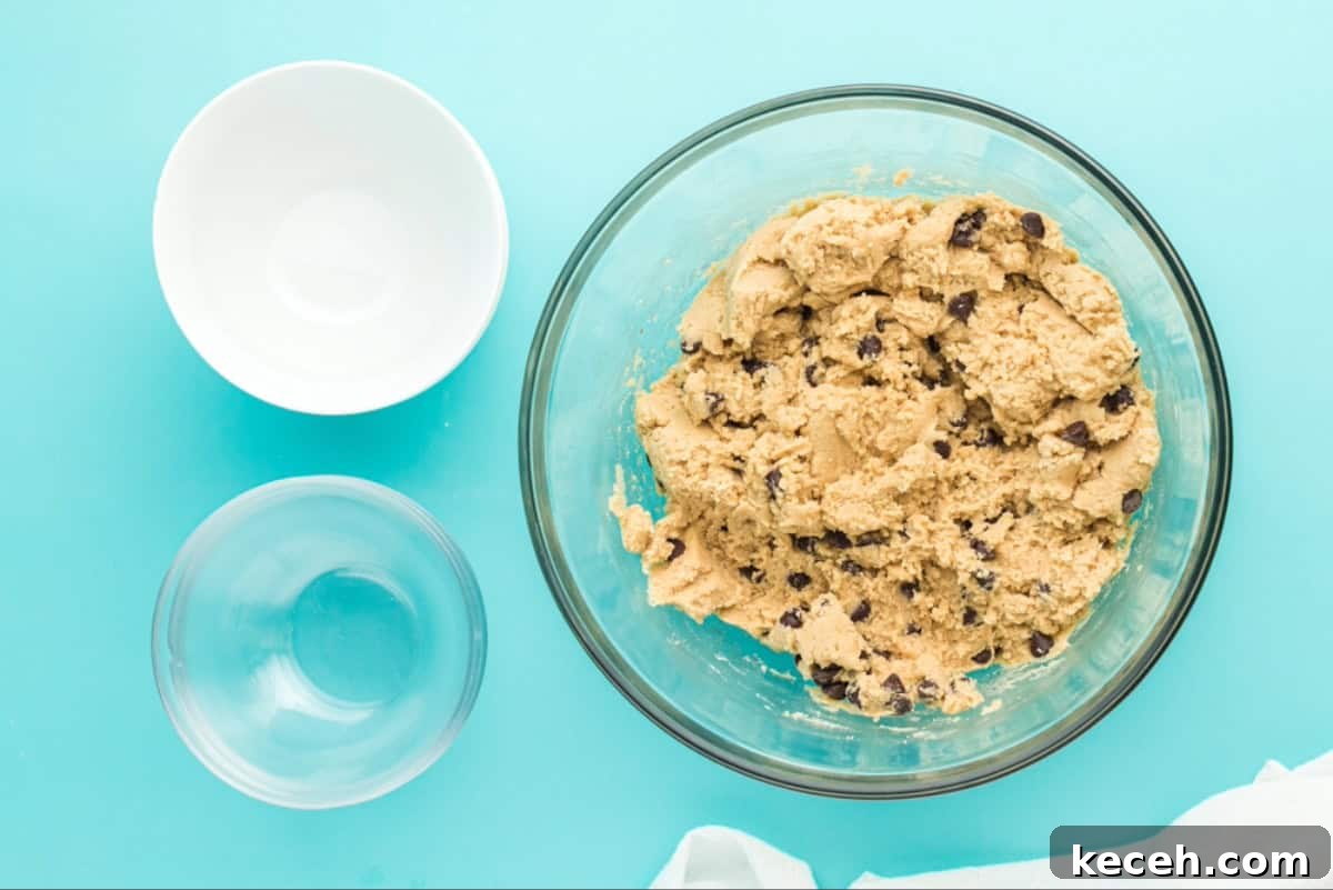 Chocolate chips folded in to cookie dough.