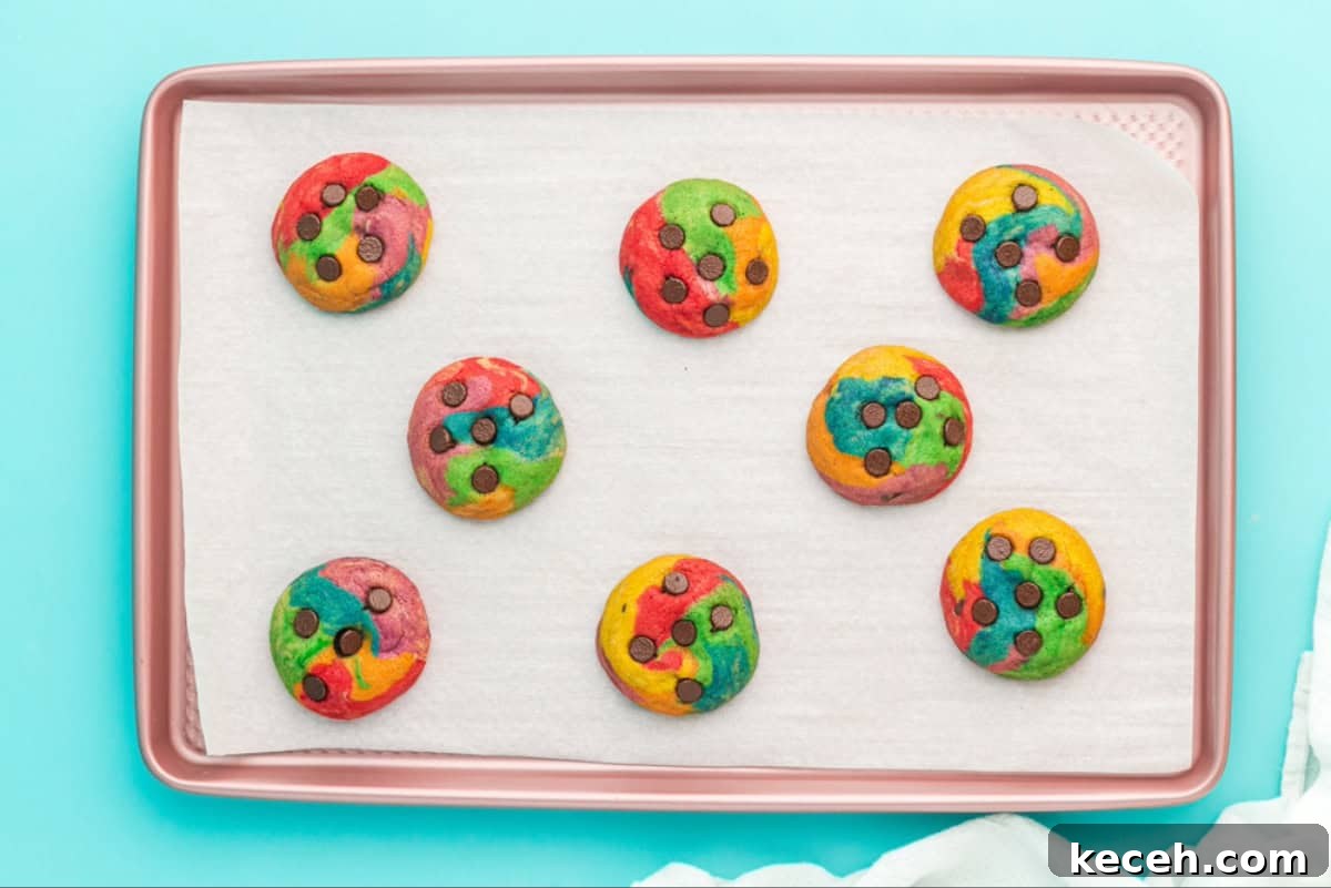 Baked rainbow chocolate chip cookies.