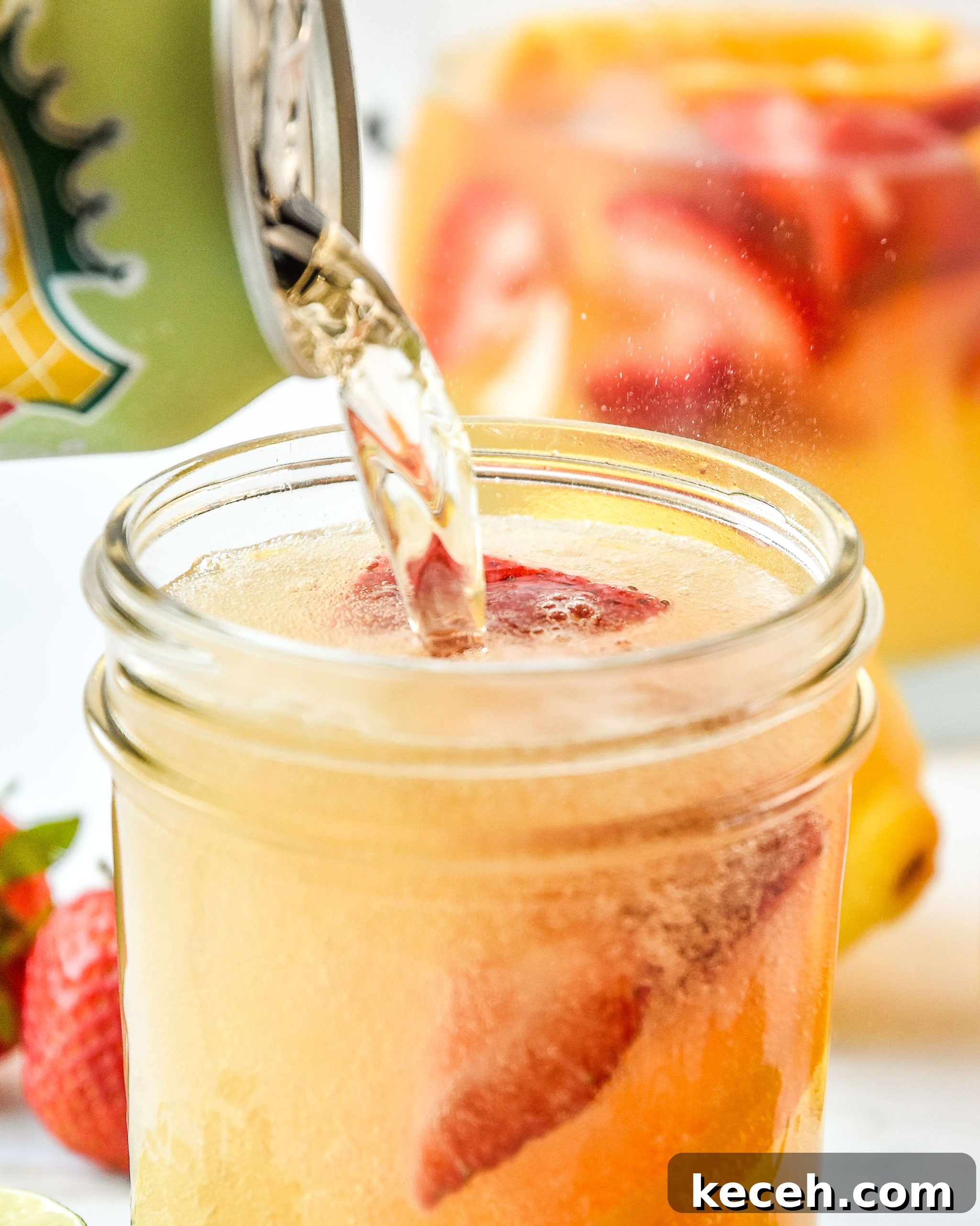 Refreshing White Wine Sangria Recipe for Summer Gatherings 5 Topping the summer white wine sangria with ginger ale
