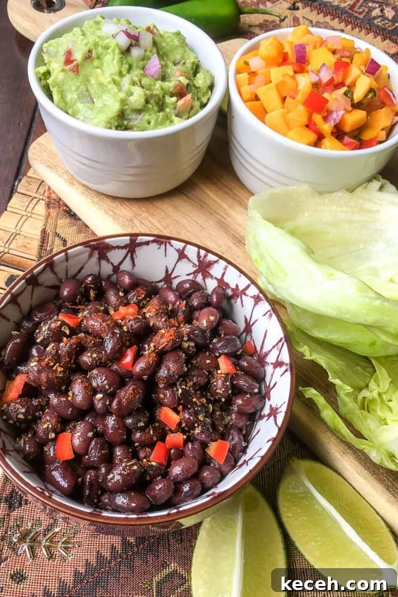 Black Bean Tacos with Fresh Homemade Guacamole Recipe 3 A bowl of black beans with red bell peppers.