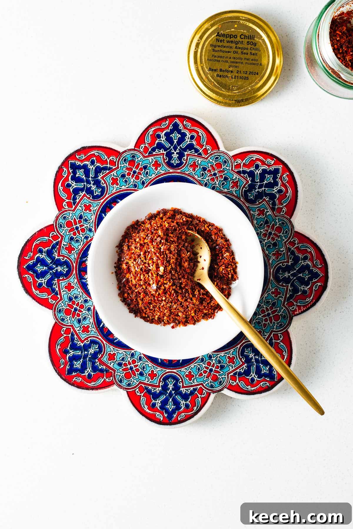 Top Substitutes for Aleppo Pepper: Flavorful Alternatives You Can Use 13 Aleppo pepper flakes in a white bowl next to a jar of Aleppo pepper.