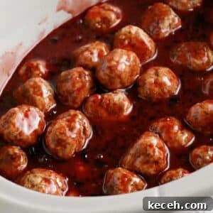 Slow-Cooker Grape Jelly BBQ Meatballs Recipe 7 Close up of Crockpot Meatballs with Grape Jelly and BBQ Sauce.