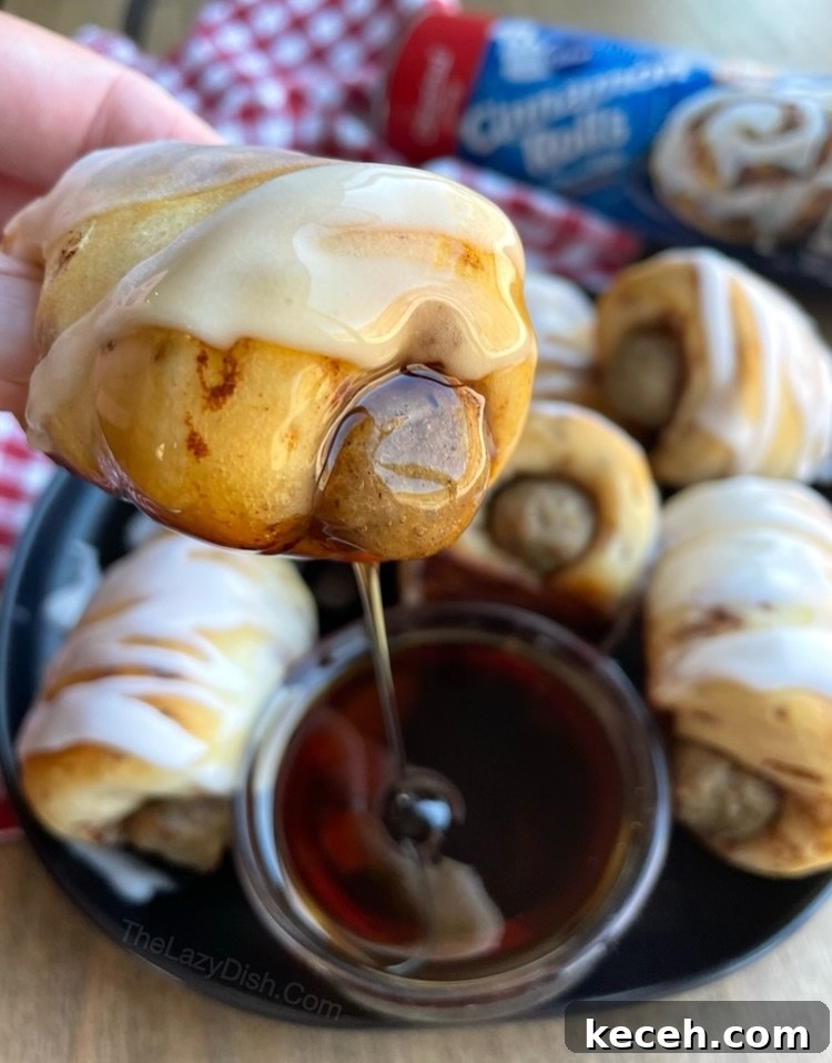 Cinnamon rolls stuffed with sausage links to make yummy breakfast pigs in a blanket!