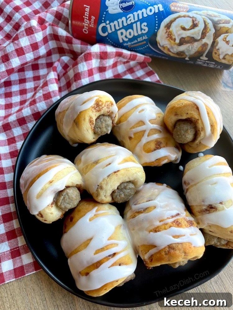 This fun and yummy breakfast is easy to make with just 2 ingredients! Pillsbury Cinnamon Rolls and frozen sausage links. Quick to bake for special occasion, birthdays, first day of school, sleepovers, and holidays. 