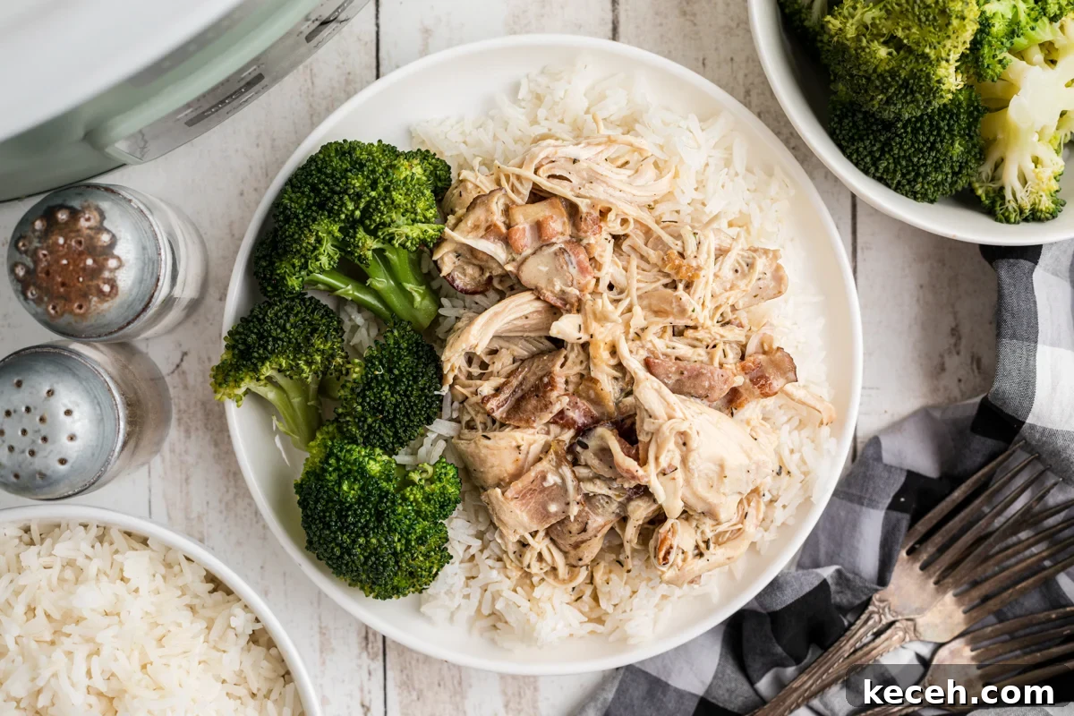Slow Cooker Chicken in Bacon Gravy — Comforting One-Pot Meal 8 Chicken, gravy, rice and broccoli on a plate.