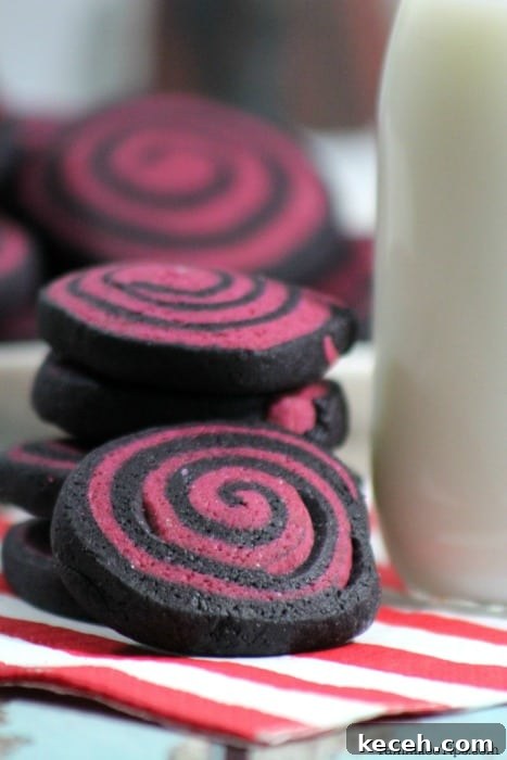 Spooky Halloween Pinwheel Cookie Recipe You’ll Love 3 purple and black pinwheel cookies